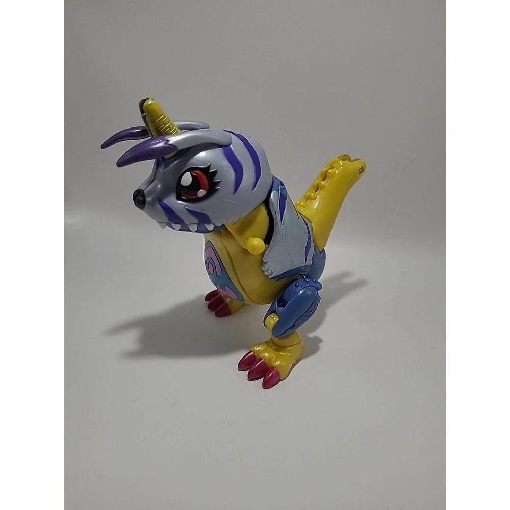 Vtg DIGIMON Digivolving Metal Garurumon digivolves to Gabumon Digimon 90%‎
